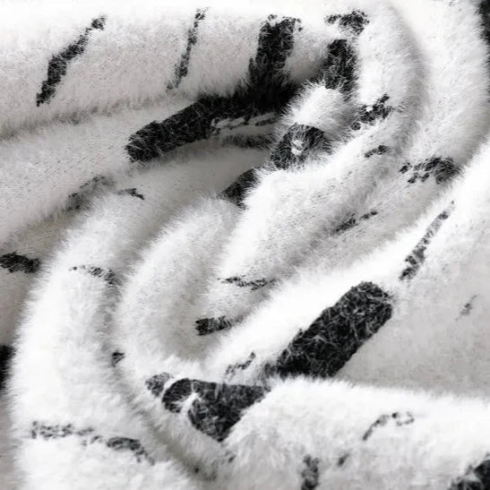 Damestriktrøje med abstrakt design