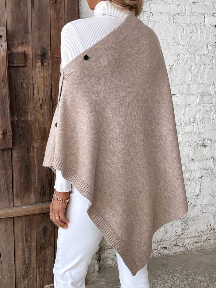 Dame poncho med knapper og struktur